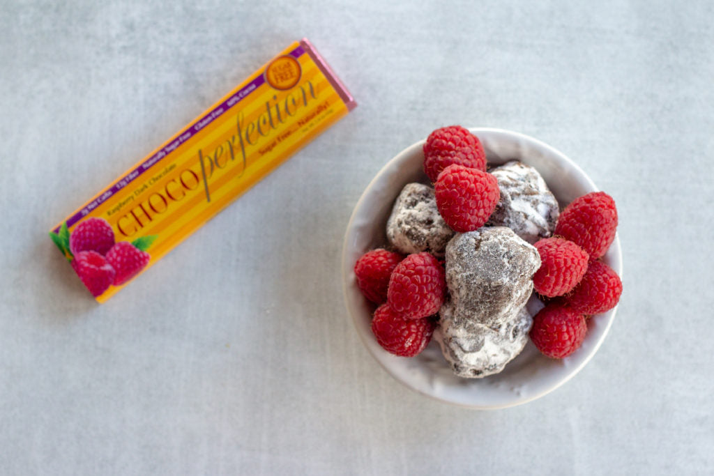 Raspberry truffles next to ChocoPerfection bar